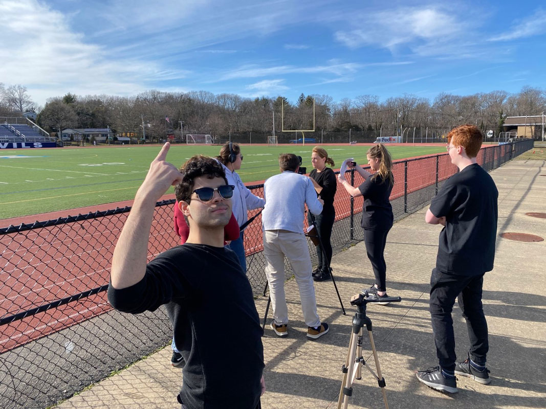 Chris Bavaro and the filmmaking team at work at Blue Devil Stadium.