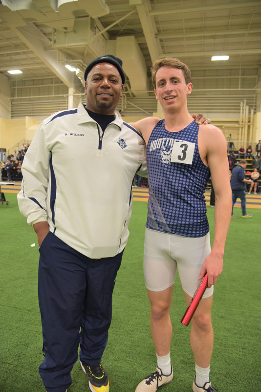Huntington head coach Ron Wilson with Blue Devil track star Justin Stevens