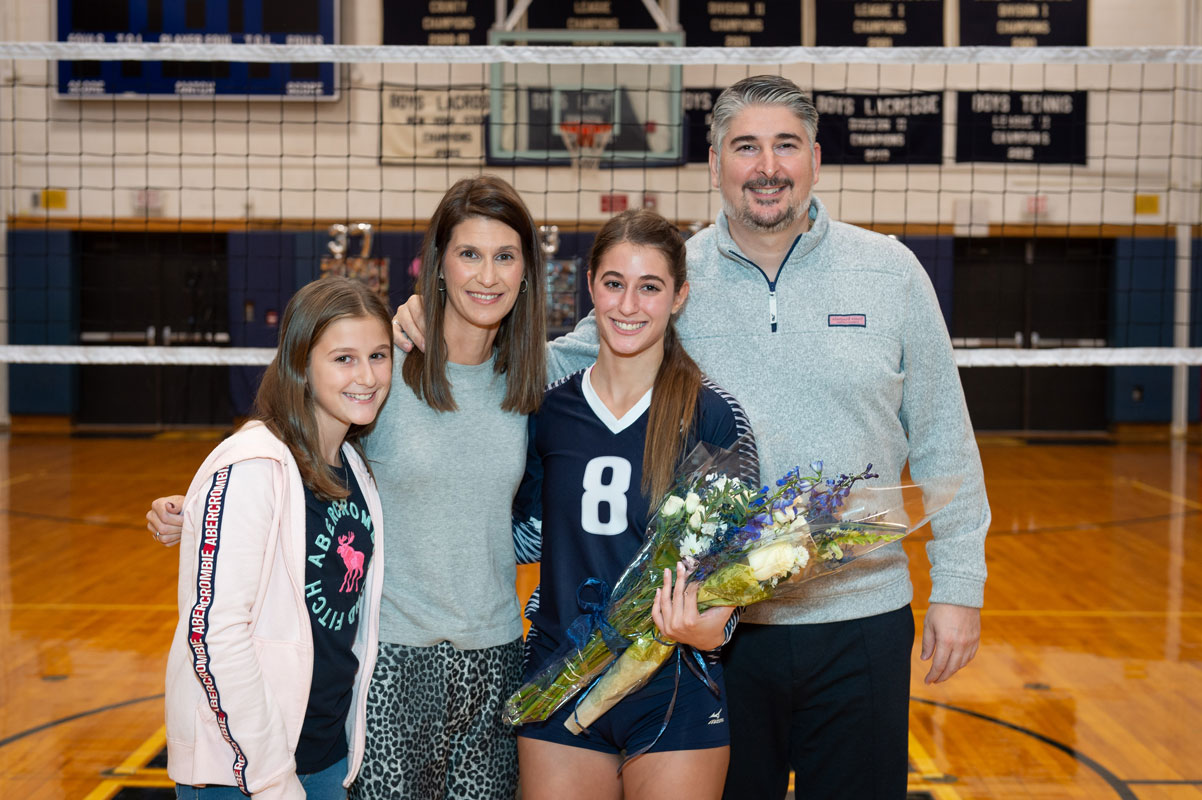 Steli Vlahos with her parents Tina and John and sister Ana on Blue Devil volleyball Senior Day. (Darin Reed photo.)