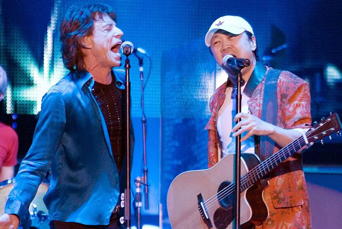 Mick Jagger of the Rolling Stones with Cui Jian.