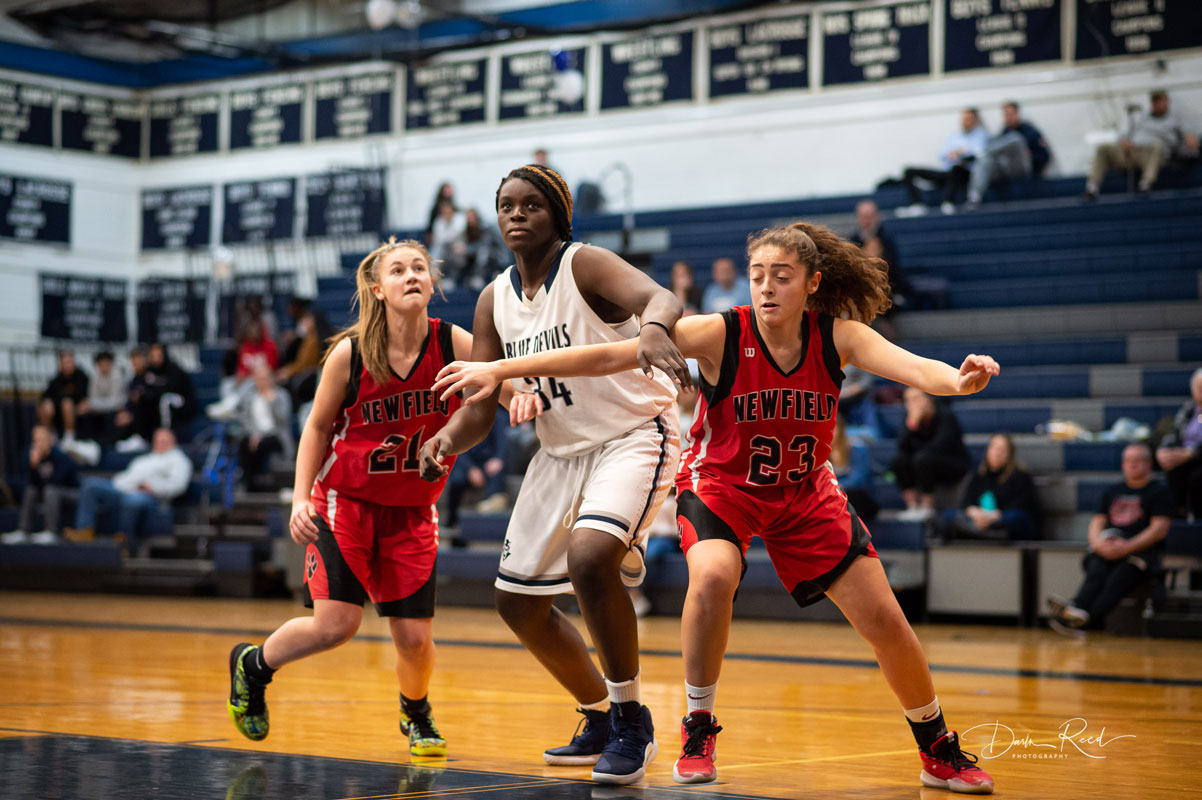 Junie Nosile (center) has worked hard to become a top player. (Darin Reed photo.)