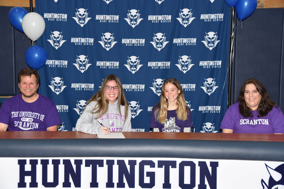 Huntington senior Julie Rogel (second from left) with her family as she commits to the UIniv. of Scranton's field hockey team.