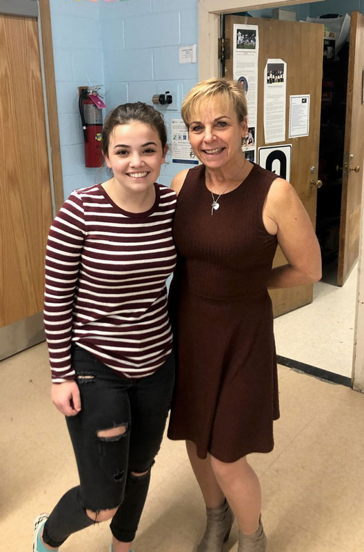  Huntington senior Taylor Case with high school business teacher Suzi Biagi.  