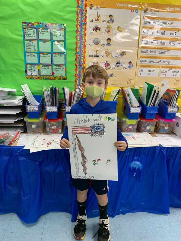 Flower Hill second graders proudly displayed their posters 