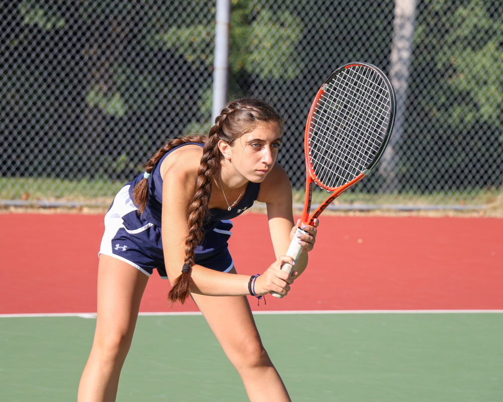 Lily O'Heir is a model of concentration for the Huntington girls' tennis team.