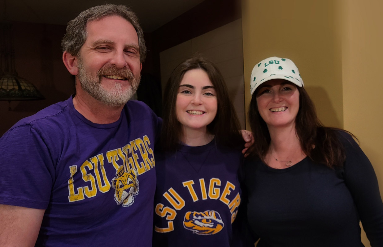 Elks scholarship recipient Maddy Meidenman is flanked by her parents, Seth and Mara.