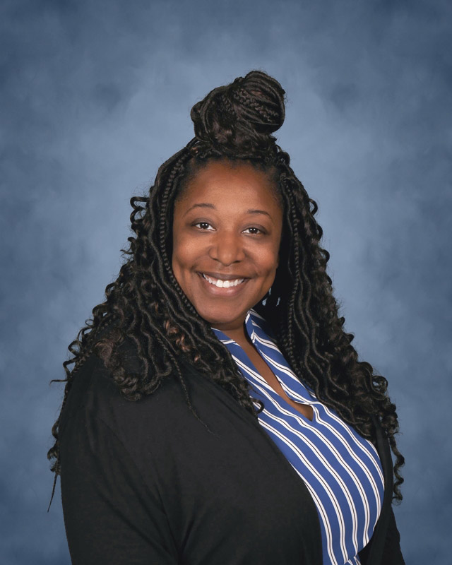 Teacher Dame Forbes is the Science Honor Society's faculty advisor.