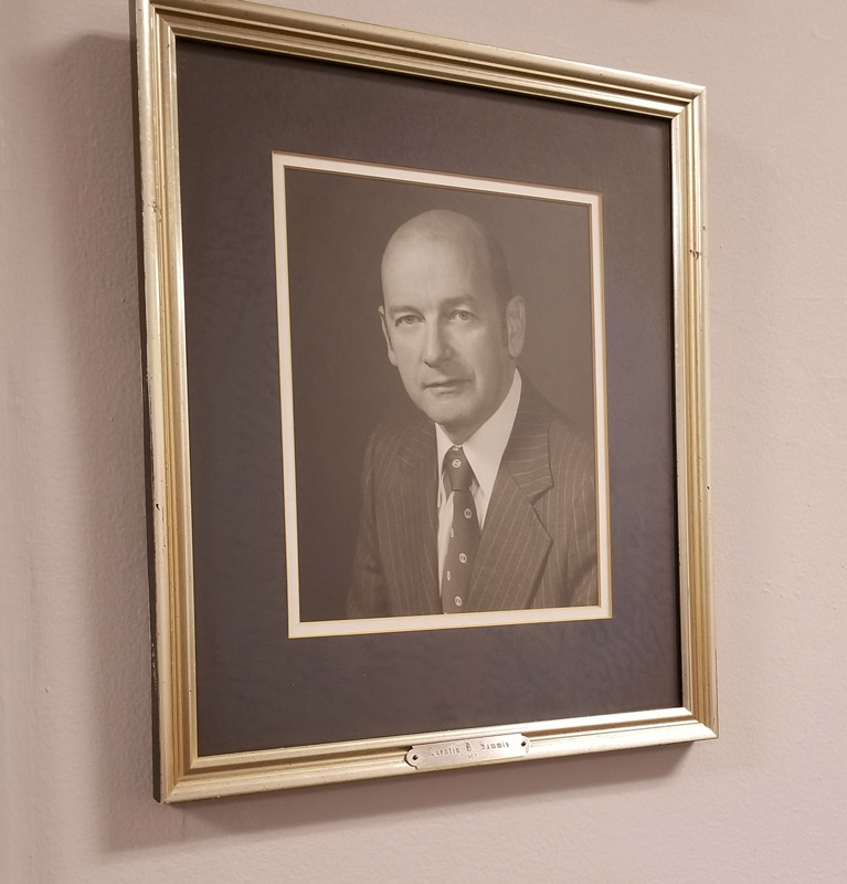 A portrait of Quentin Sammis hangs at Huntington Town Hall.