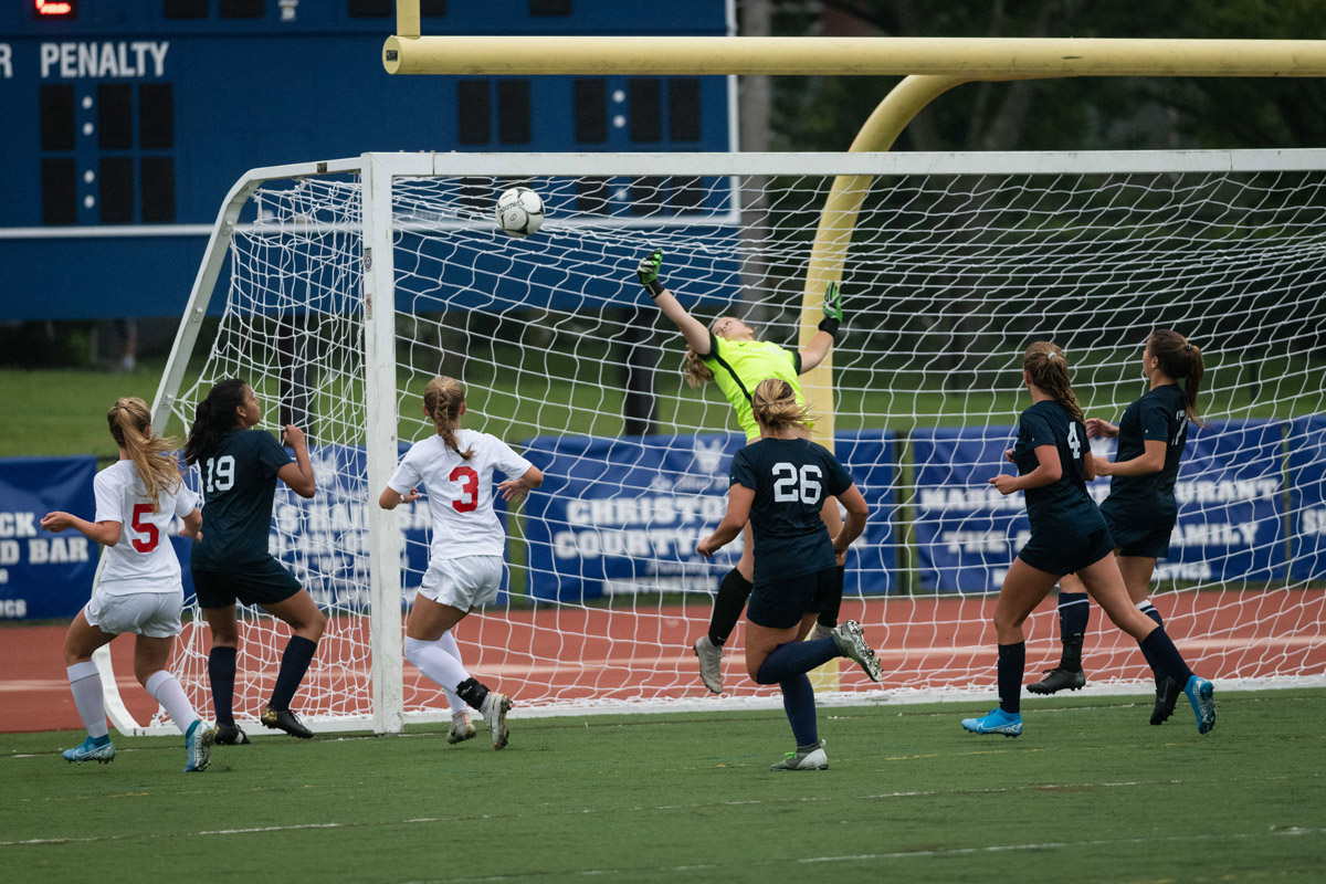 Huntington goalie Ainsley Lumpe deflects a shot. (Darin Reed photo.)