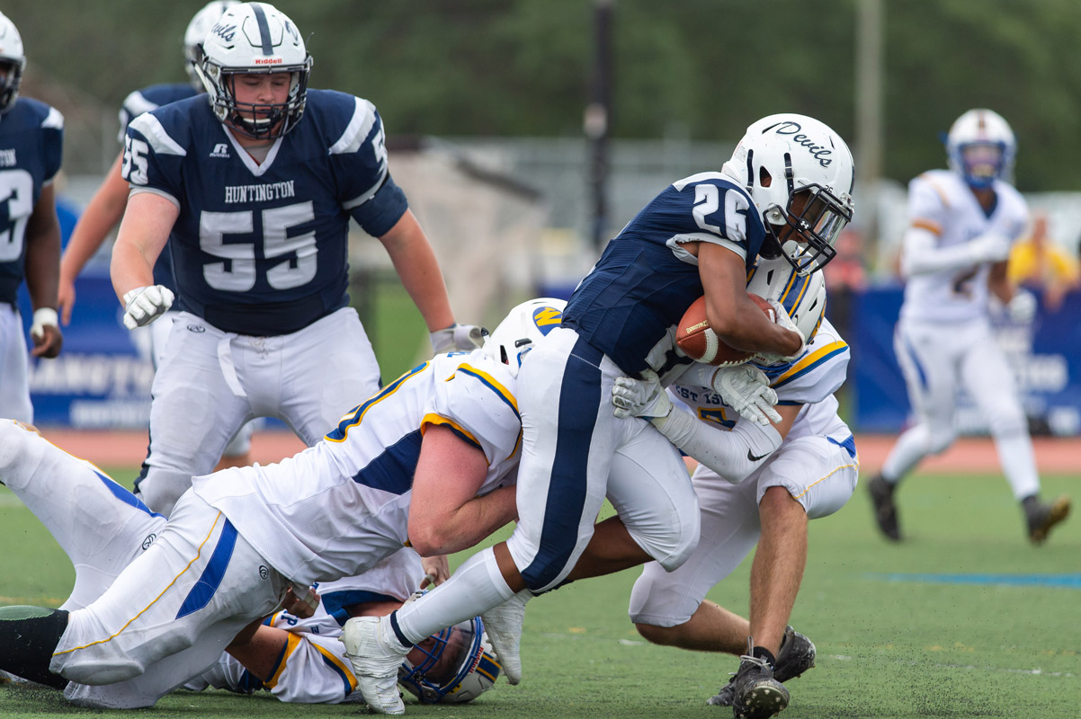 It takes two tacklers to bring down Josiah Melendez. (Darin Reed photo.)