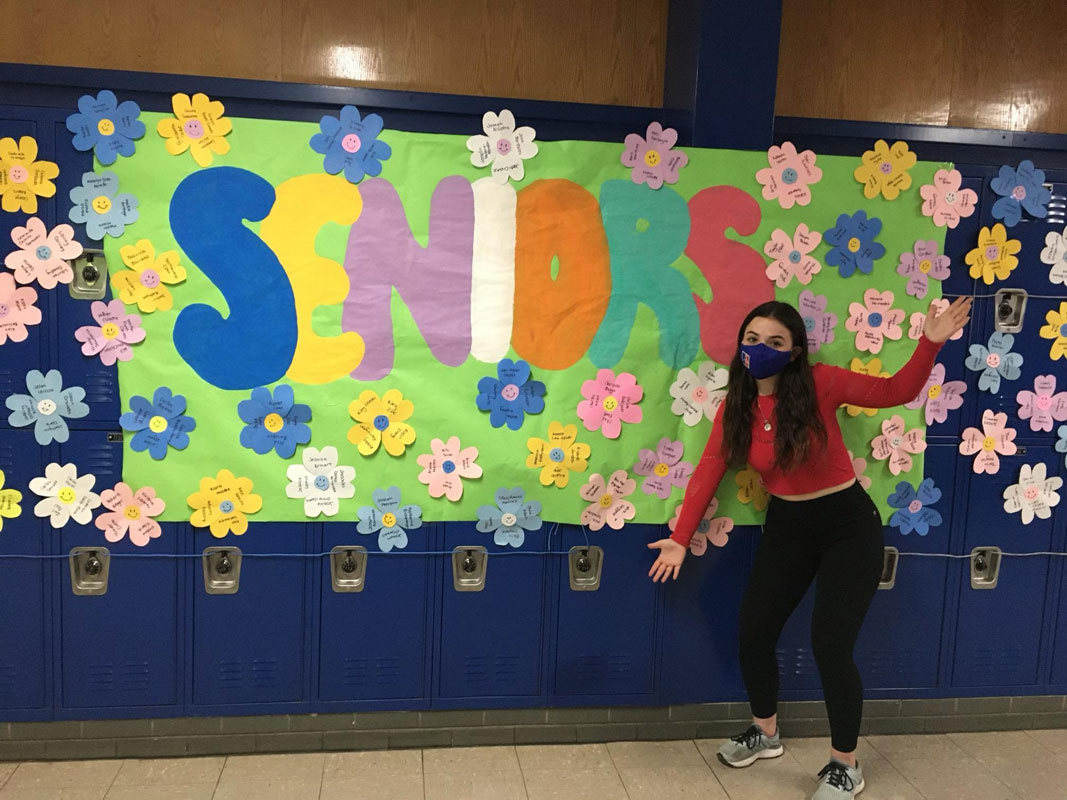 Taylor Case near the display she created to welcome back seniors. 