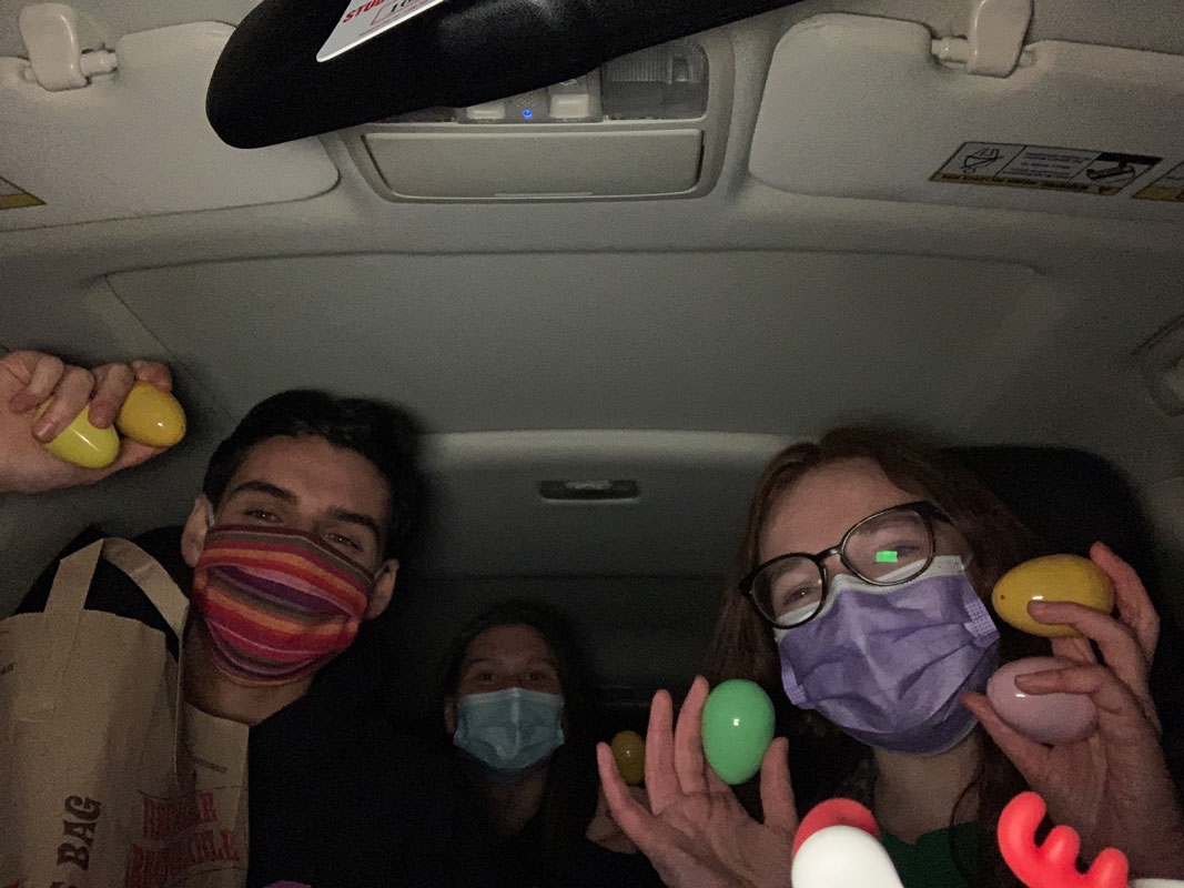 Virtual Enterprise course students on their way to hide eggs around local yards 