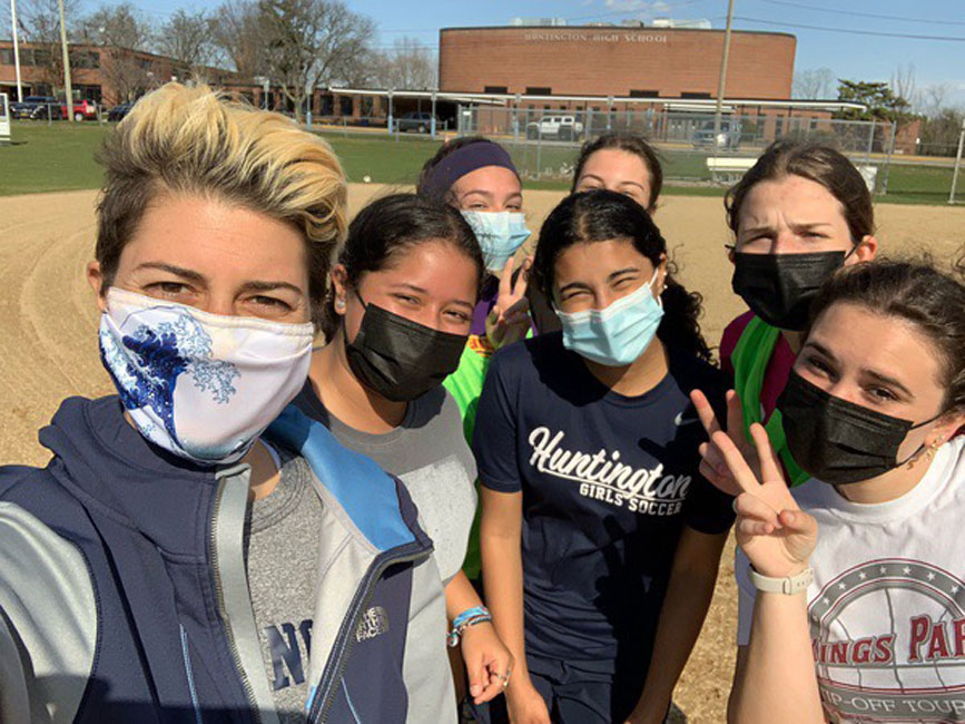 Head coach Maria Canino (left) with some of her JV players. 