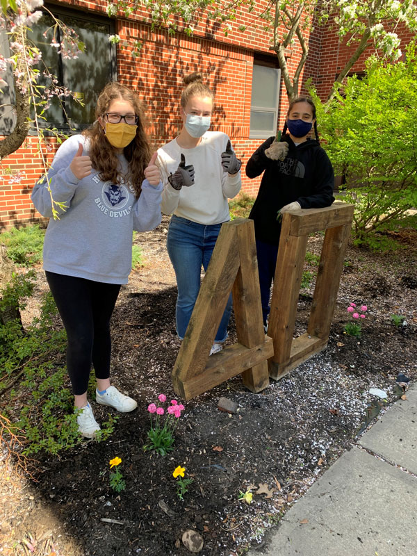 The Huntington environmental club members had fun sprucing up Eli's Garden 