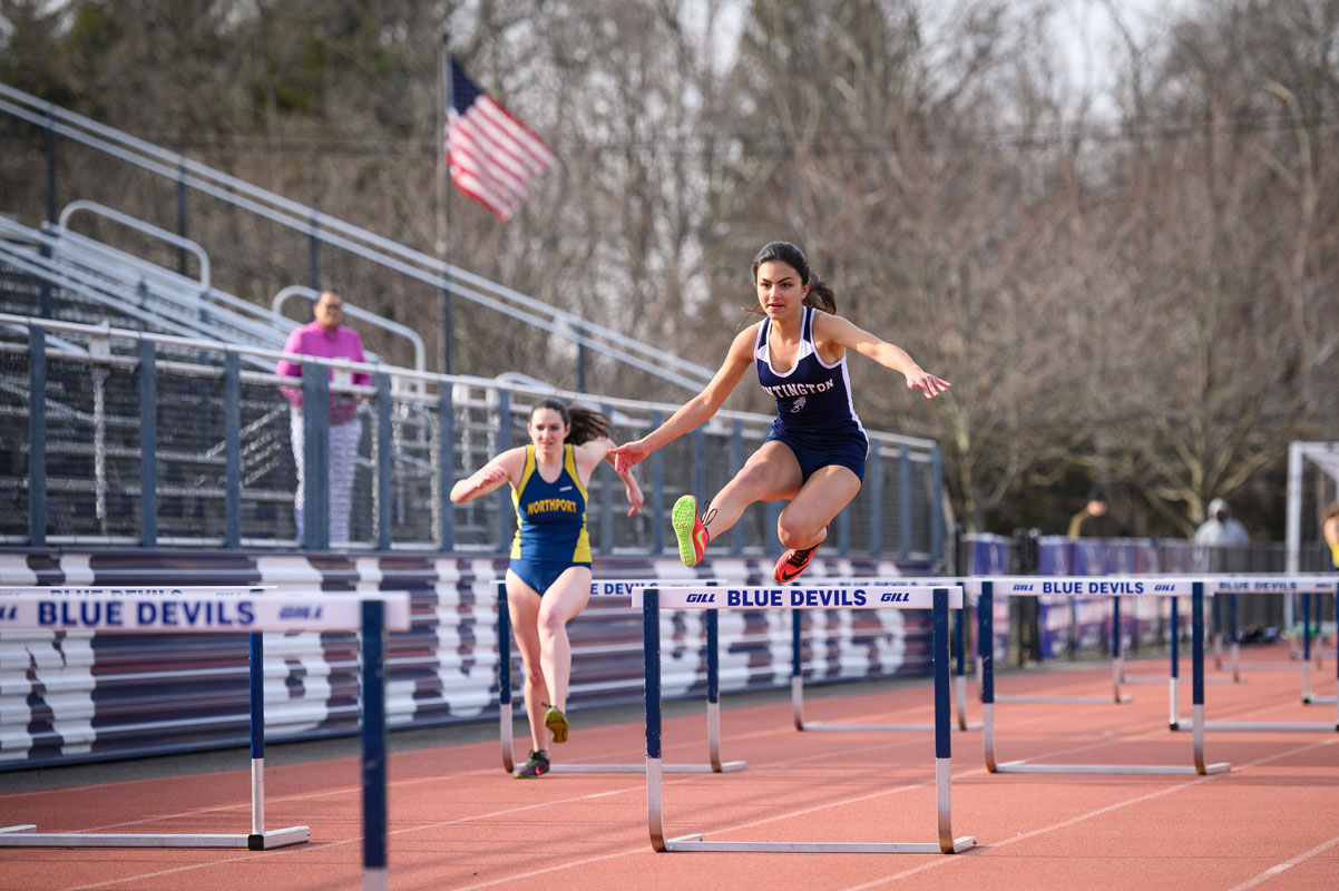 Brianna Halbeisen sails over a hurdle for Huntington. (Darin Reed photo)