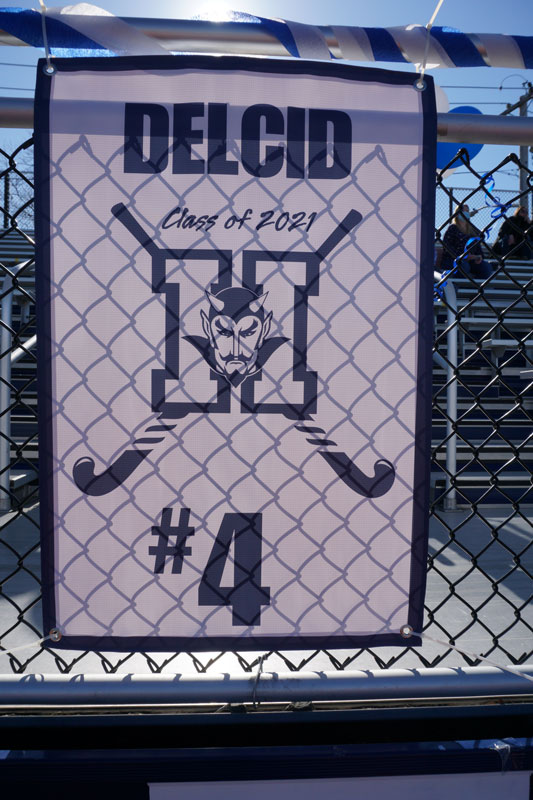 Banners featuring the names and numbers of each of the seniors were hung on the bleachers on Senior Day.