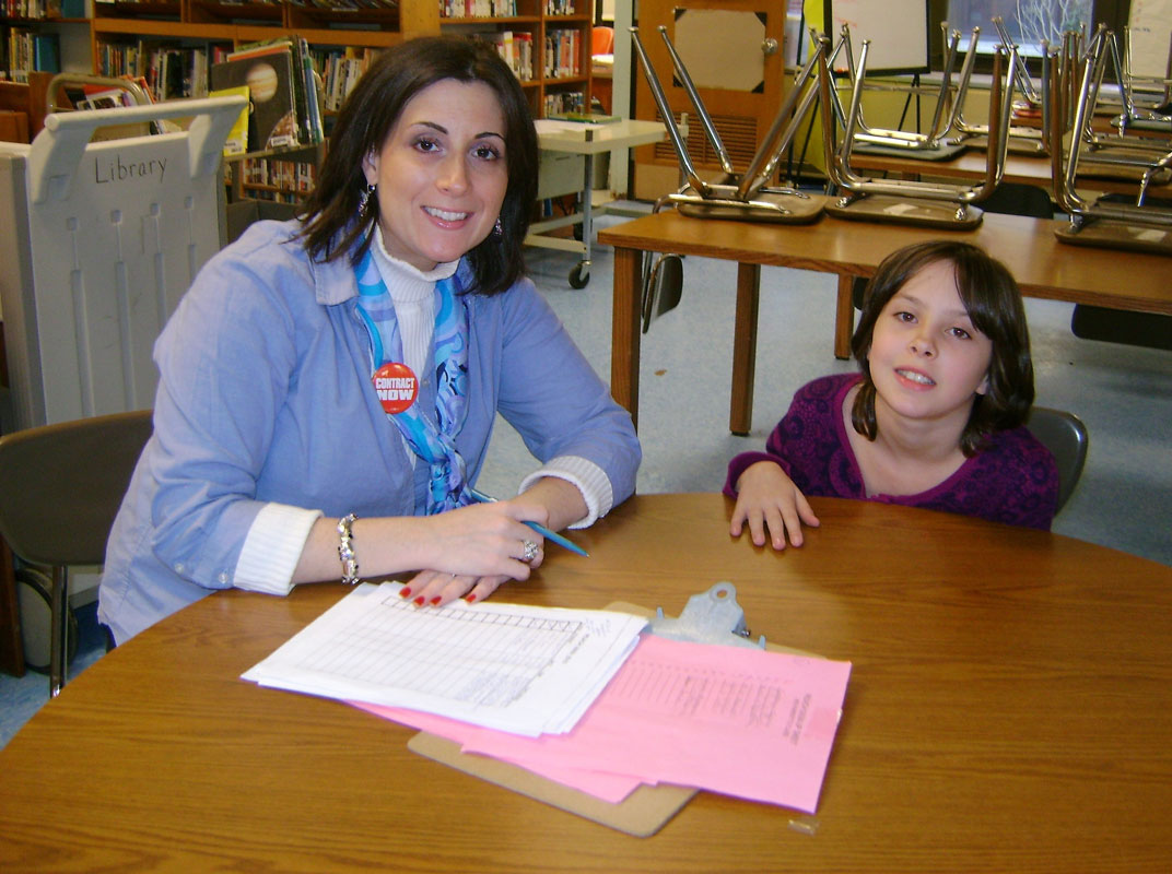 Huntington librarian Christine Amodeo Palmer works with a student