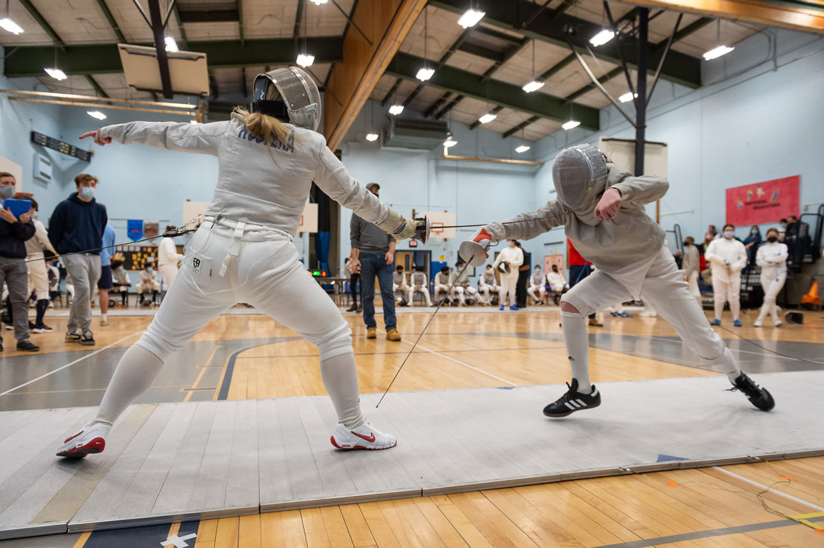 Ally Kustera (left) is one of Huntington's best fencers. (Darin Reed photo.)