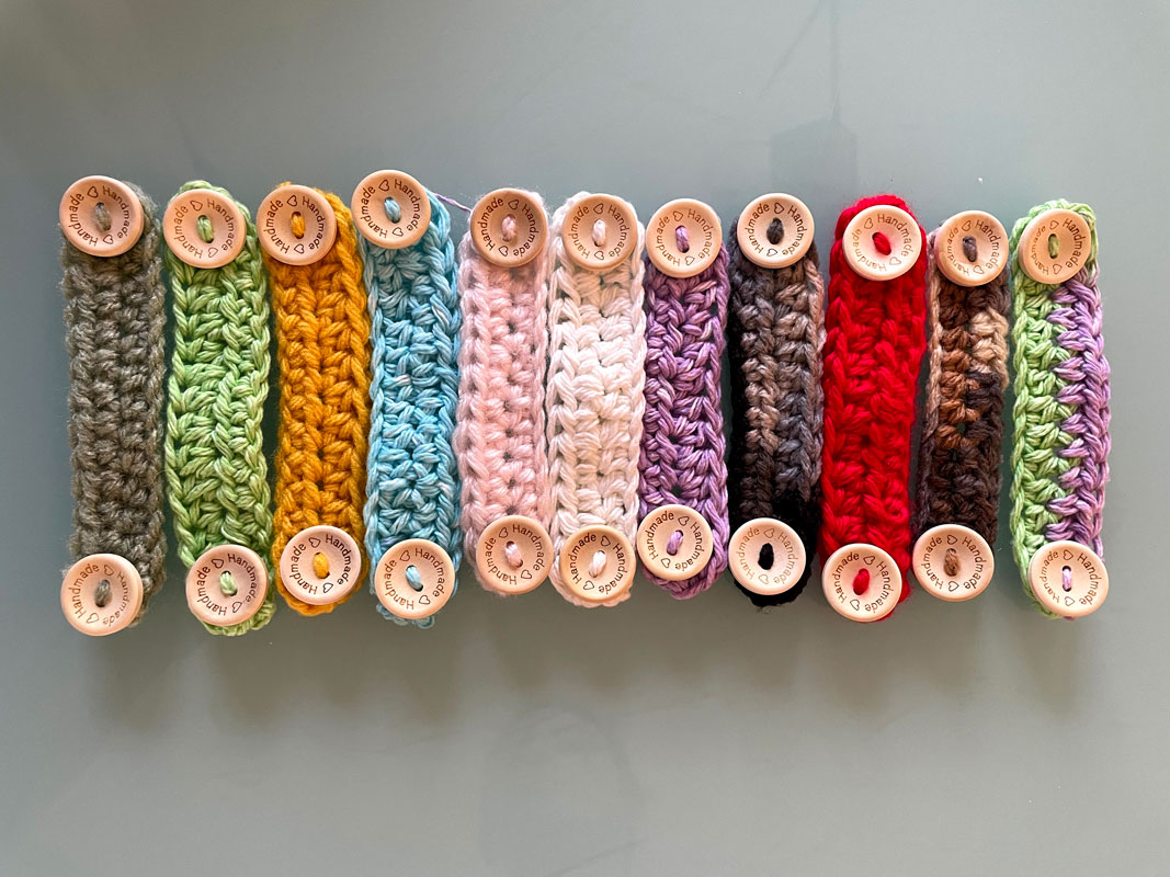 The New World Club is selling crocheted ear savers that attach to face masks 