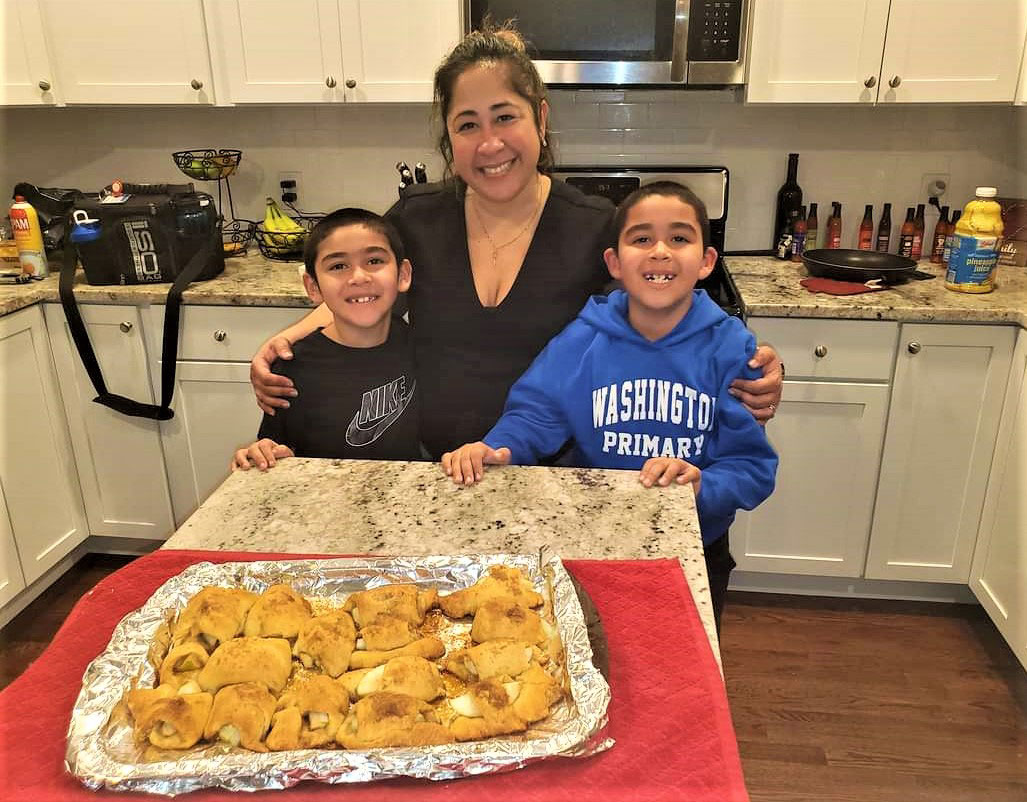 Aiden and Matthew Rivera with their mom, Evelyes.