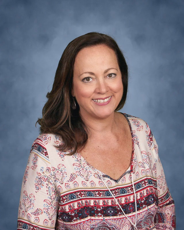 Teacher Eileen Gonzalez is the New World Club's energetic faculty advisor.