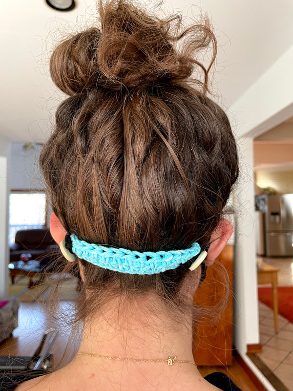 The New World Club is selling crocheted ear savers that attach to face masks 