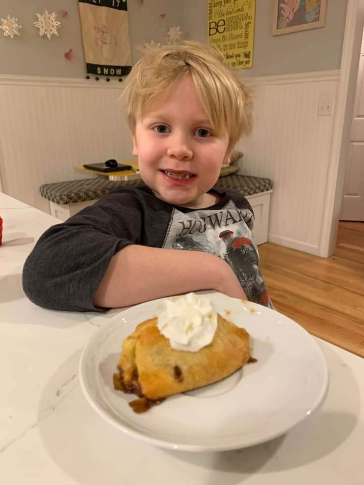 Third grader Samuel Simon with a dish of tasty treats.