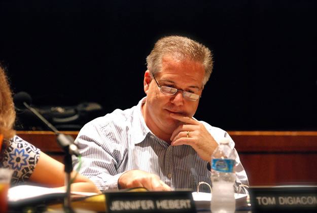 Trustee Tom DiGiacomo concentrates at a Huntington School Board meeting.