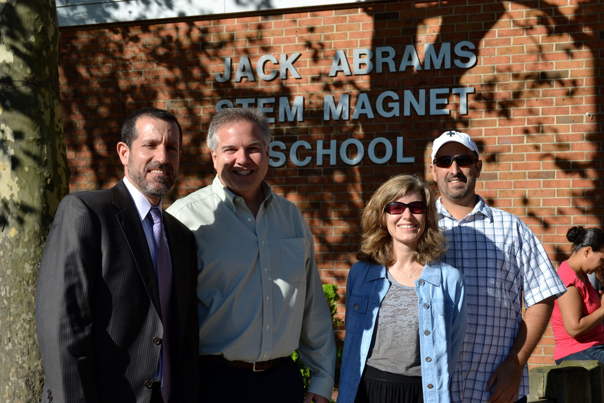 Jim Polansky (left) with Trustees Tom DiGiacomo, Jennifer Hebert and Adam Spector at the Jack Abrams STEM Magnet School ribbon cutting in 2013.