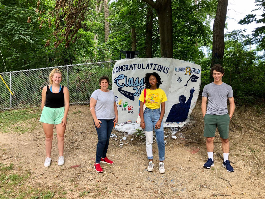 Ilene Messina presented bELIeve scholarships to Holly Wright, Shyann Maragh and Julien Rentsch at The Rock last June.
