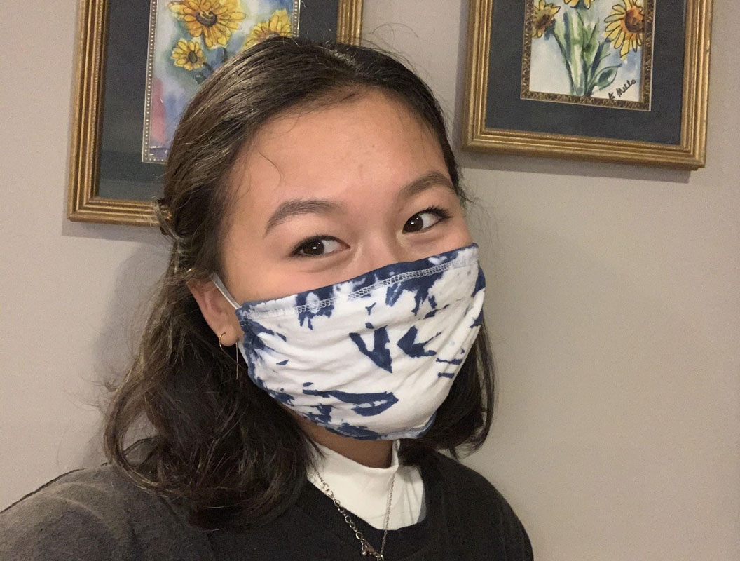 French Honor Society President Gemma Pellegrini models on the masks the group is selling.