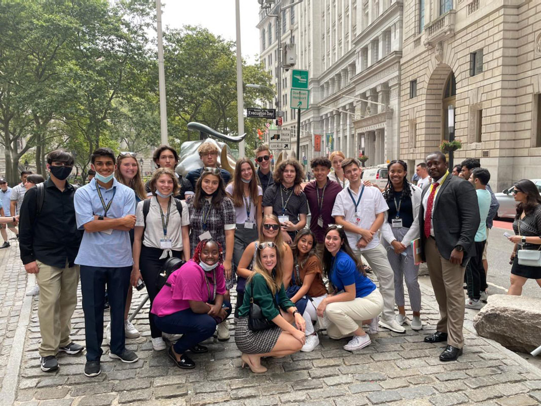 Naysa Escobar (crouching right) with her business classmates in New York City.