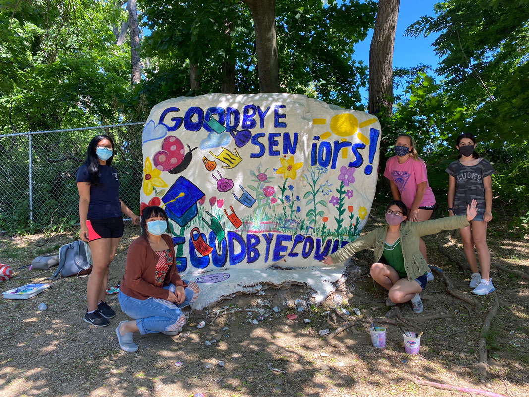 Art Honor Society members recently painted The Rock in a tribute to the Class of 2021
