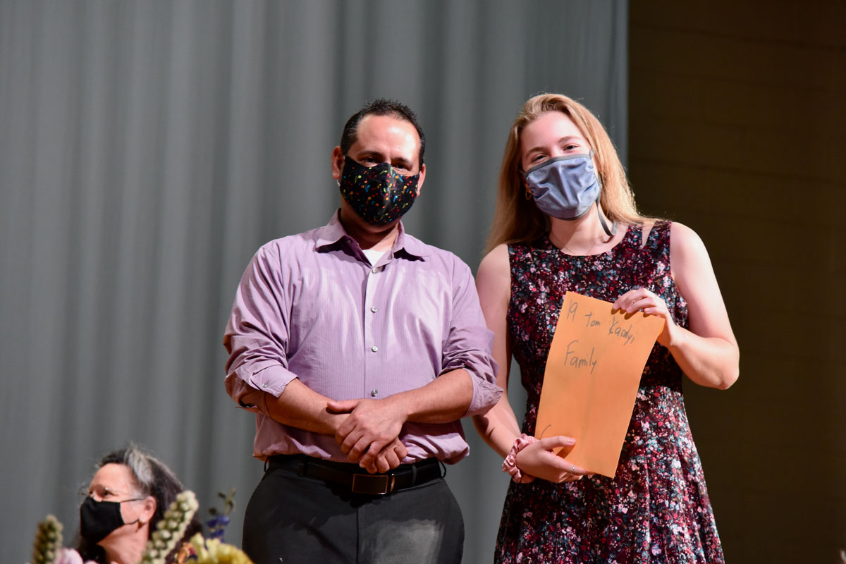 HHS music teacher Jason Giachetti presented Grace Wildermuth with the Thomas Karolyi Memorial Orchestra  Scholarship.