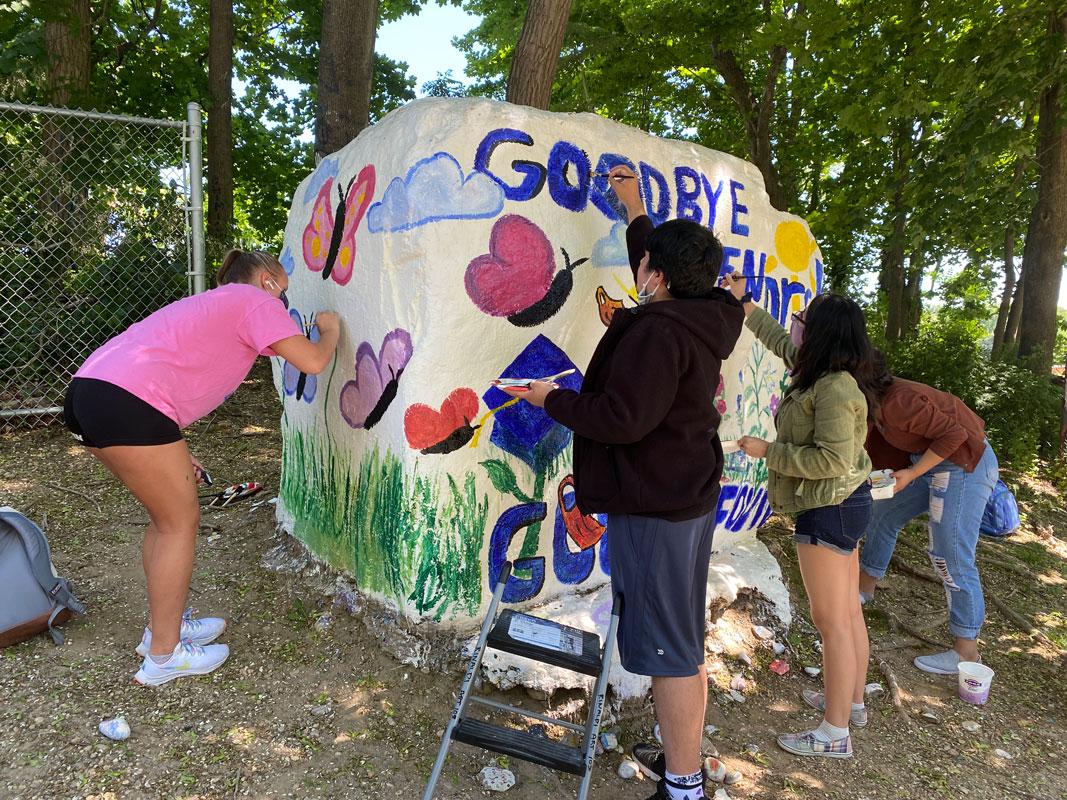 Art Honor Society members recently painted The Rock in a tribute to the Class of 2021 