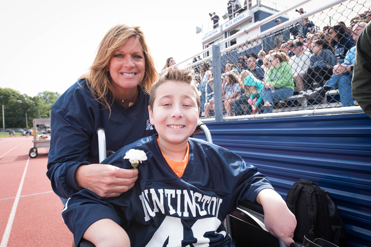 Eli Mollineaux at Blue Devil Stadium with Director of Athletics Georgia McCarthy. (Darin Reed photo.)