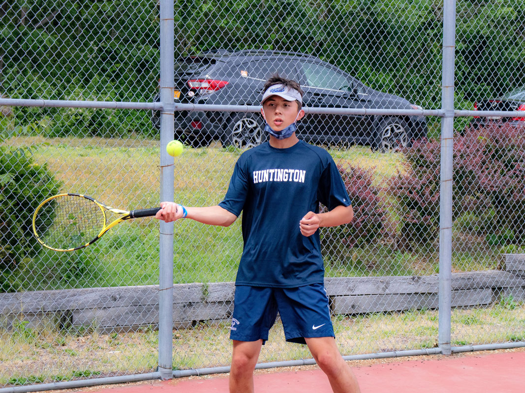 Aaron Chin warms up prior to a match.