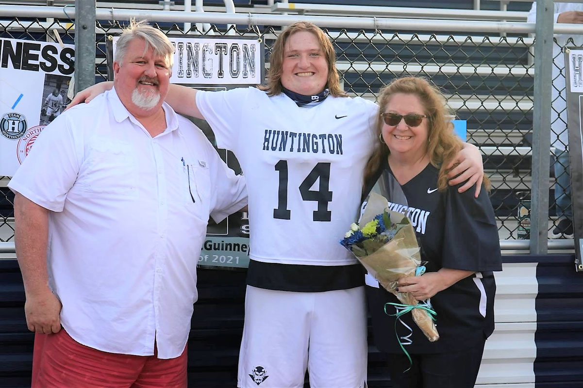 Ethan McGuinness with his parents on Blue Devil boys' lacrosse Senior Day.