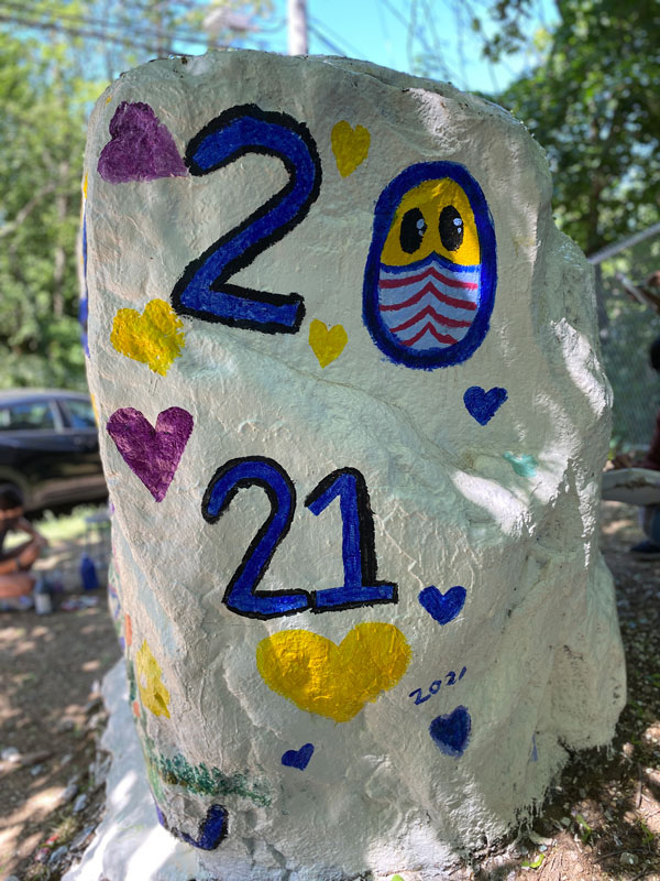 Art Honor Society members recently painted The Rock in a tribute to the Class of 2021 