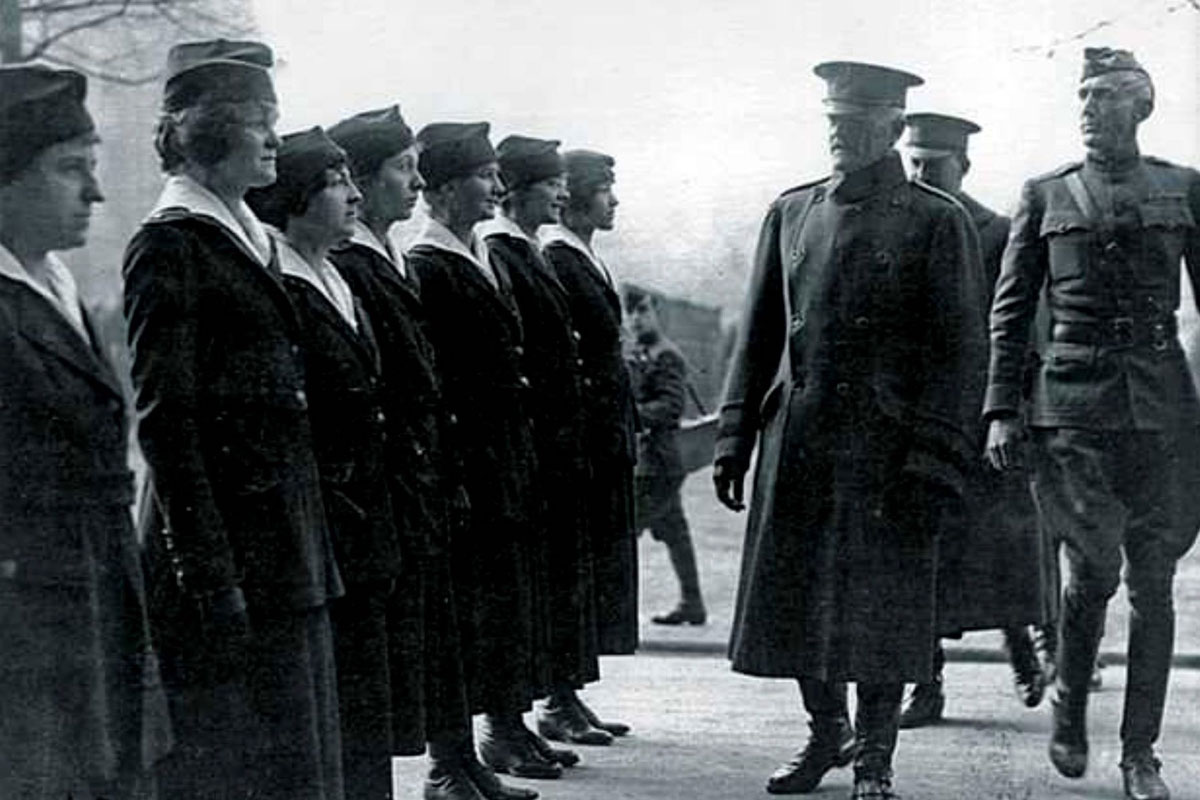 Military officials inspect a unit of Hello Girls.