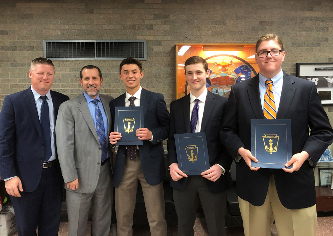 Aaron Chin, Rob Harrington and Matthew Colavecchio with Principal Brenden Cusack and Supt. Jim Polansky at National Honor Society induction. (Madelyn Reed photo.)