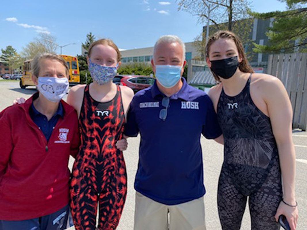 Coaches Meg McConnell and Chris Helmke with Caelan Clayton and Kathryn Montefusco.