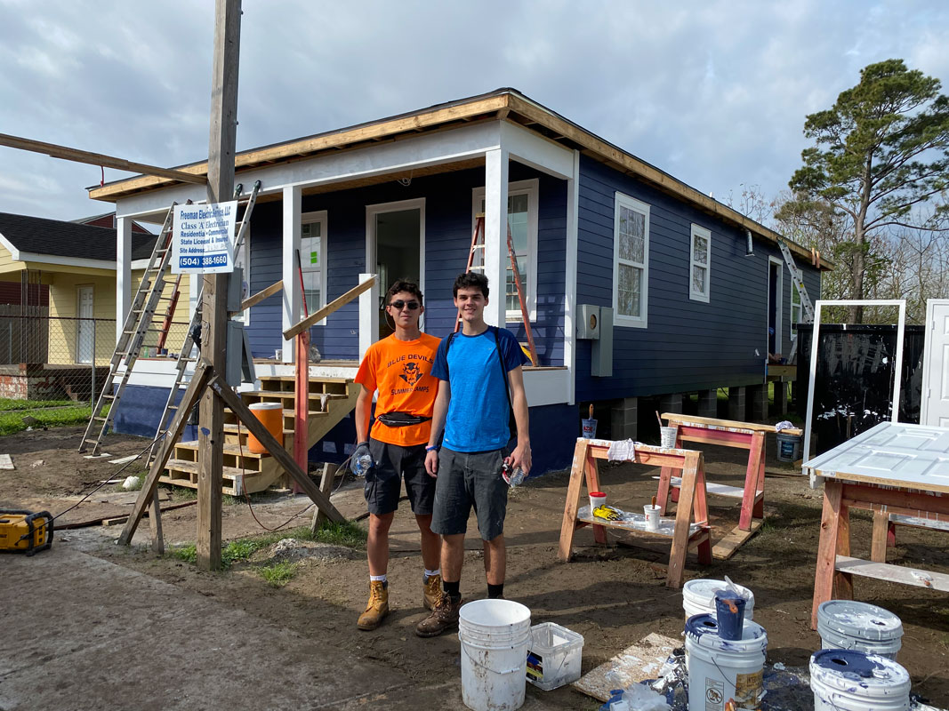 Aaron Chin (left) in New Orleans with Huntington's Habitat for Humanity club chapter.