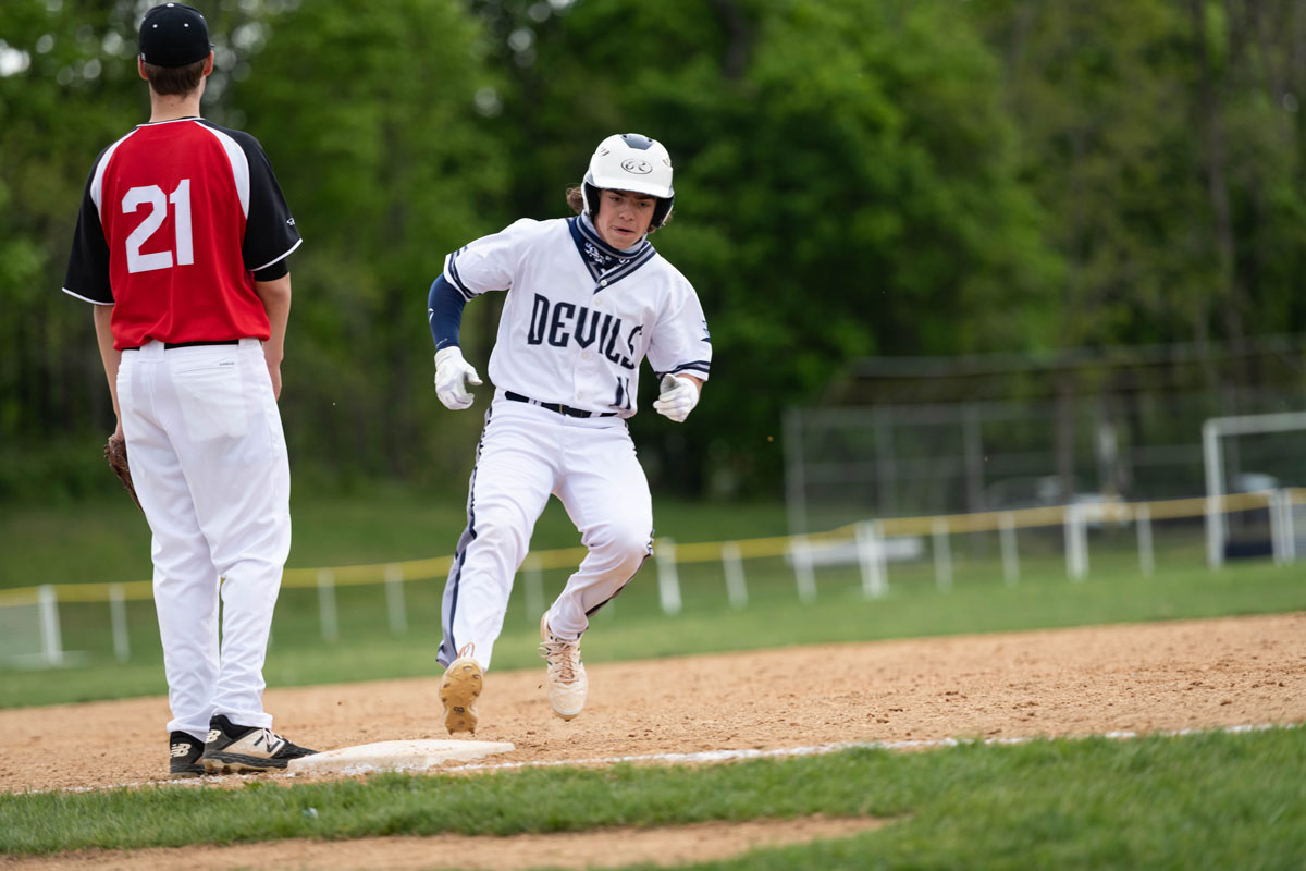 Alex Bellissimo hustles into third base in Tuesday afternoon's game. (Darin Reed photo.)