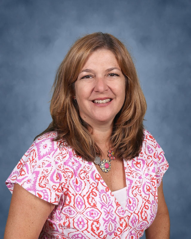 Teacher Nadine Araoz is co-advisor of Huntington's Spanish Honor Society.