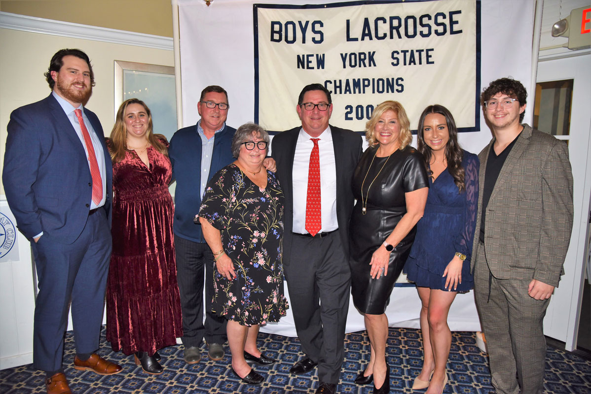Paul McDermott is surrounded by his family at last week's Booster Club gala 