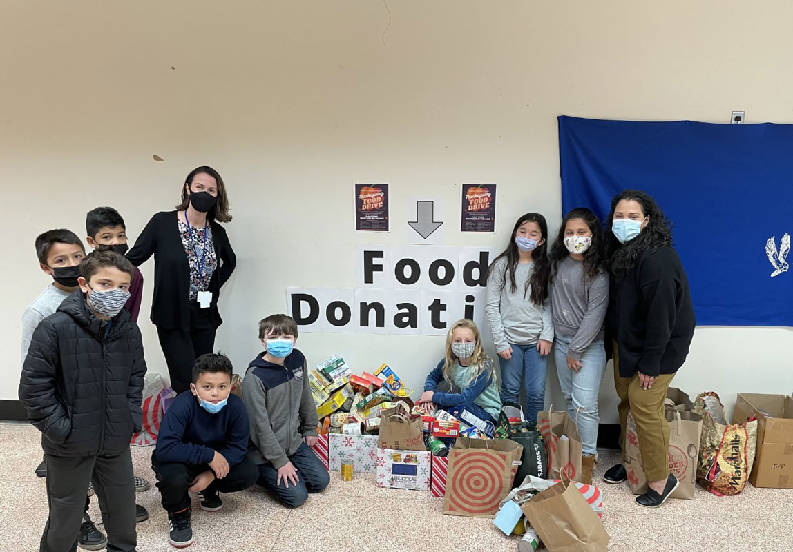 Woodhull social workers Catherine Juliano and Mary Guzman-Lewis helped organize a Thanksgiving food drive.