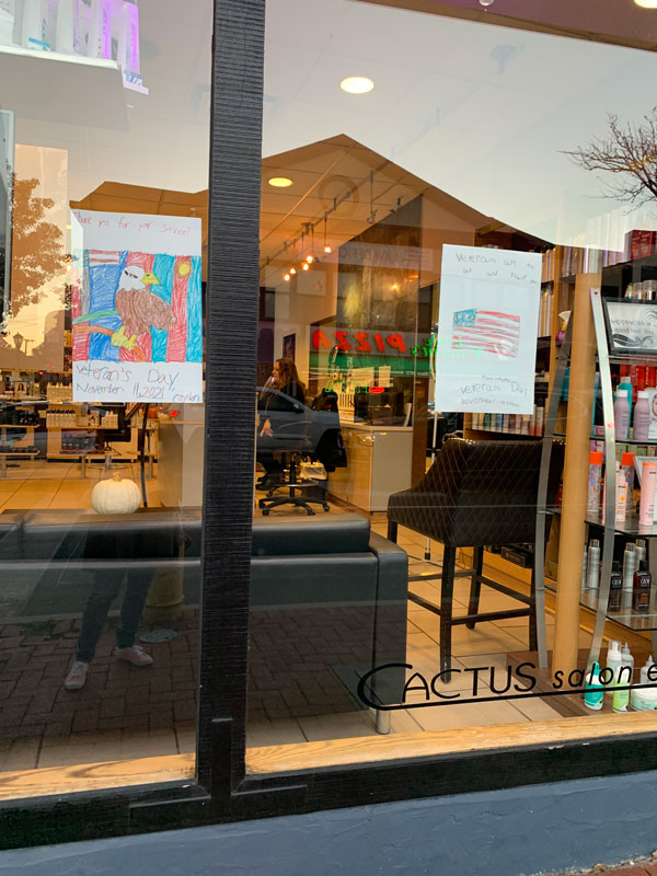 Flower Hill second graders decorated storefronts with artwork celebrating local veterans 