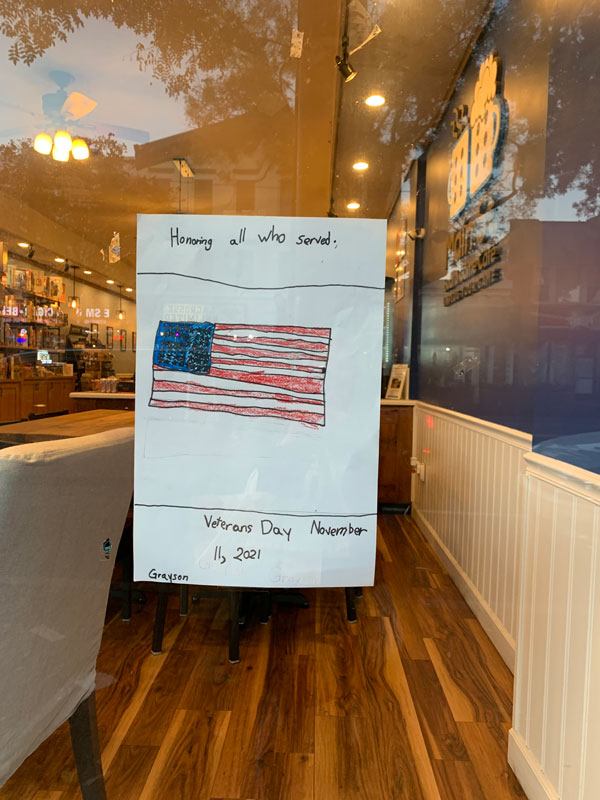 Flower Hill second graders decorated storefronts with artwork celebrating local veterans 