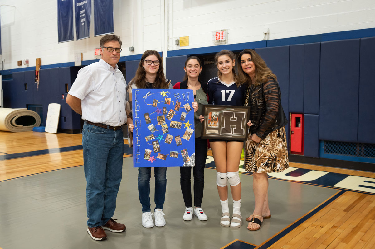 Senior Francesca Stamatatos with her family on Senior Day. (Darin Reed photo.)